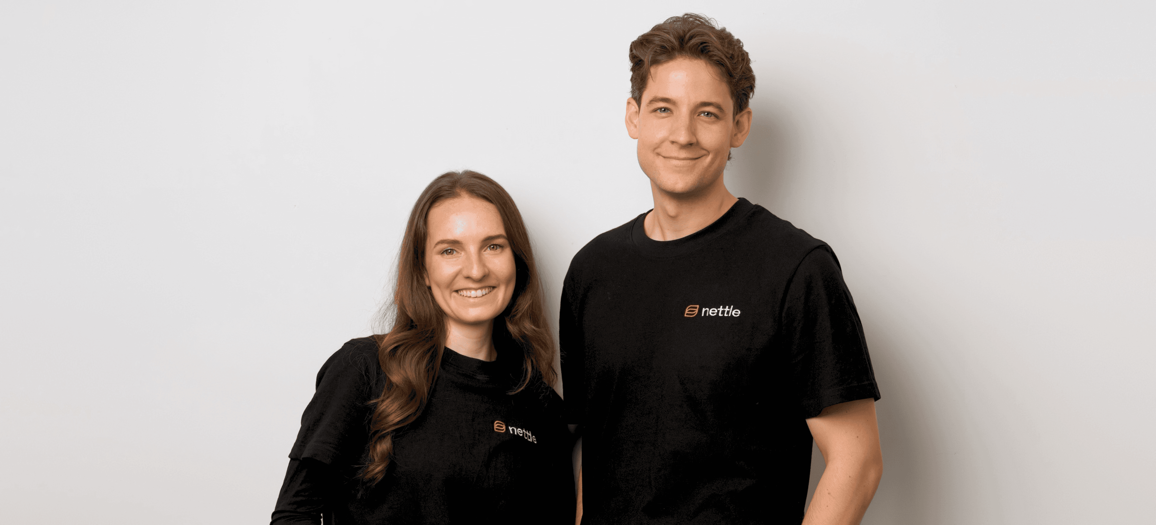 Nettle’s co-founders standing together in their office.